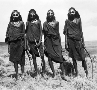 Group portrait of four Maasai youths, standing, carrying bows and blunted arrows, Ngorongoro District, Tanzania, 1961 (b/w photo), Wilfred Patrick Thesiger, (1910-2003) / Pitt Rivers Museum, Oxford, UK